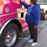 1551594_822932014407315_2525146517261985406_n: Breast Cancer Survivor writing her name on the fire truck