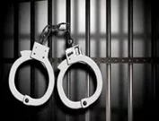 wpid-arrest-7-handcuffs-on-left-with-cell-bars-jpg-26
