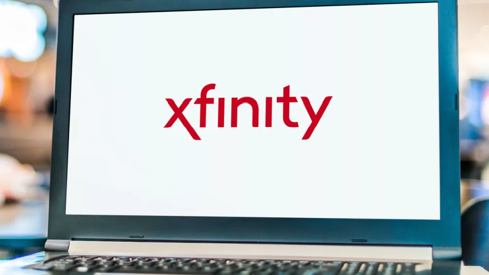 Laptop computer displaying logo of Xfinity^ the trade name of Comcast Cable Communications^ LLC to market consumer cable television^ internet^ telephone.