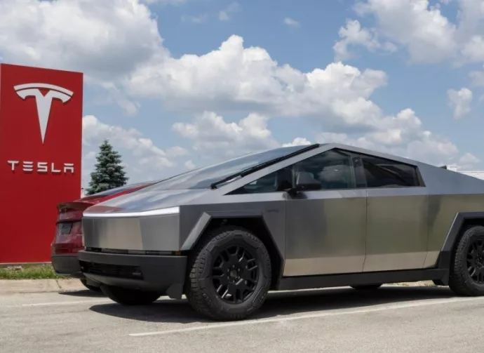 Tesla Cybertruck display at a dealership. Tesla claims the Cybertruck has a driving range of up to 340 miles. Indianapolis - May 19^ 2024: