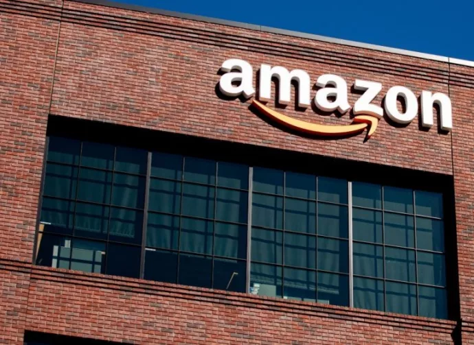 Closeup of Amazon logo on the company office building in East Palo Alto^ Silicon Valley^ San Francisco Bay Area. Amazon sign on brick building wall East Palo Alto^ California US - October 17^ 2024