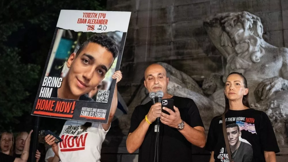 Adi Alexander speaks with Yael at his side^ parents of Edan Alexander at rally and memorial service for 6 hostages who were kidnapped and murdered by Hamas on Columbus Circle in New York on Sep 1 2024