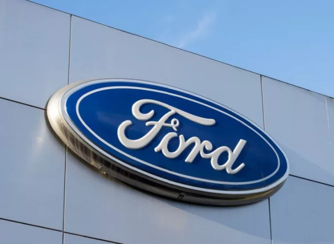 Closeup of the Ford logo seen at a Ford dealership store in Sunnyvale^ California. Ford Motor Company is an American multinational automobile manufacturer. Sunnyvale^ CA^ USA - Nov 22^ 2023