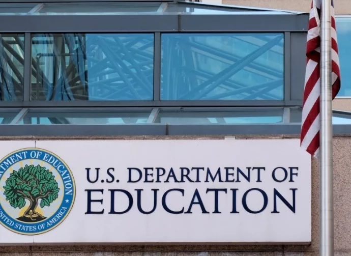 The exterior sign and US flag in front of the U.S. Department of Education offices. Washington^ DC USA; September 5^ 2024: