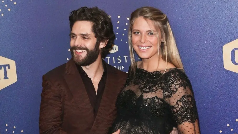 Thomas Rhett (L) and wife Lauren Akins attend the 2019 CMT Artists of the Year at Schermerhorn Symphony Center on October 16^ 2019 in Nashville^ Tennessee.