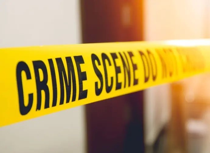 crime scene tape in front room door with flare and vintage tone