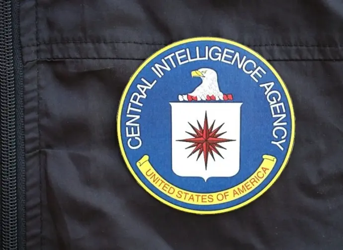 United States of America Central Intelligence Agency coat of arms as pin on black uniform jacket close up