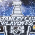 Stanley Cup Playoffs logo displayed at the NBC Experience Store window in midtown Manhattan
