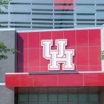 UH (University of Houston) logo sign on the building at TDECU Stadium in Houston^ Texas^ USA. Houston^ Texas^ USA - April 5^ 2024