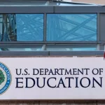 The exterior sign and US flag in front of the U.S. Department of Education offices. Washington^ DC USA; September 5^ 2024: