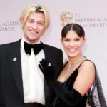 Millie Bobby Brown and husband Jake Bongiovi attend the EE British Academy Film Awards 2022 at Royal Albert Hall in London^ England. London^ United Kingdom - March 13^ 2022: