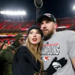 taylor-swift-travis-kelce-afc-championship-2025-billboard-1800999239