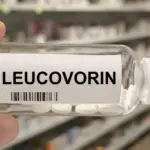 Bottle of LEUCOVORIN tablets on a hospital pharmacy table used to reduce methotrexate toxicity a folinic acid supplement.