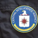United States of America Central Intelligence Agency coat of arms as pin on black uniform jacket close up