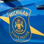 State of Michigan police coat of arms on squad car Dimondale MI - June 4^ 2022
