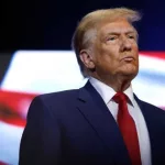 President Donald Trump looks on during a roundtable with faith leaders at Christ Chapel on October 23^ 2024