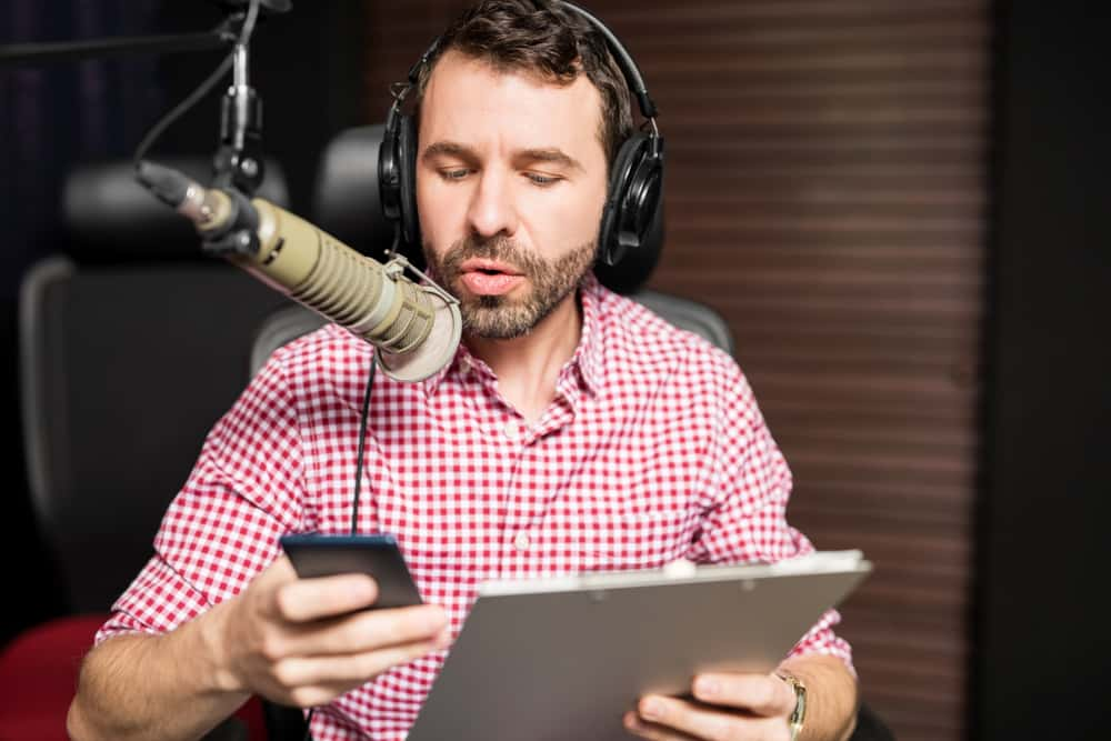 radio-man-holding-phone