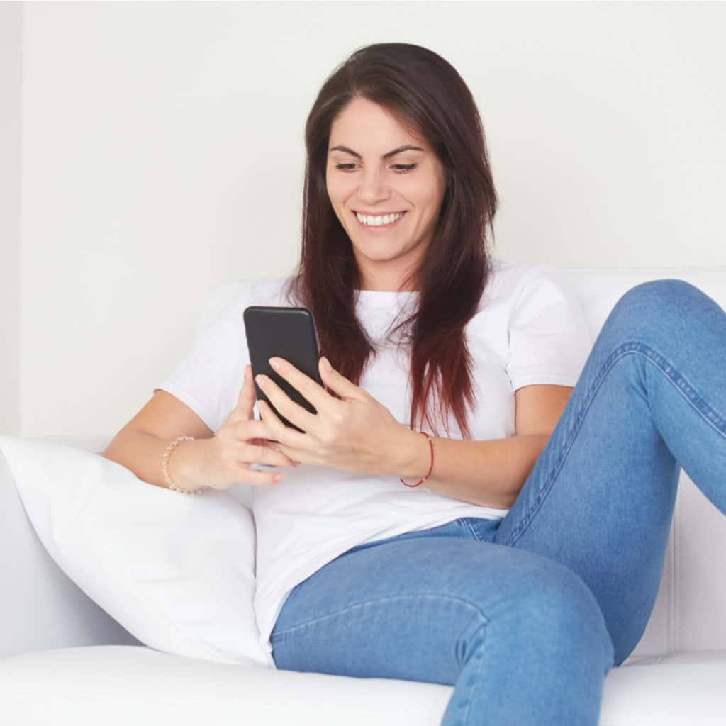 woman-on-phone-on-couch-square