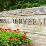 The entrance sign of Cornell University on campus of Cornell University. Cornell University is a private^ Ivy League university Ithaca New York - June 27^ 2021