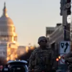 Members of the National Guard patrol the area surrounding the outskirts of the Capitol Building on January 19^ 2021^ in Washington D.C.