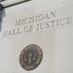 State of Michigan seal on the Michigan Hall of Justice Building; Lansing MI - May 6^ 2023