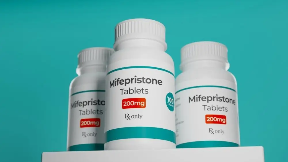Mifepristone tablets in bottle. RU-486 Medical abortion pills. Used in combination with misoprostol. 3D illustration.