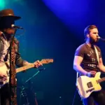 NEW YORK-MAY 6: Singers T.J. Osborne (R) and John Osborne of Brothers Osborne perform onstage at the Paramount on May 6^ 2016 in Huntington^ New York.
