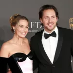 Margot Robbie and Tom Ackerley attend the 2024 EE BAFTA Film Awards at The Royal Festival Hall in London^ England. February 18^ 2024