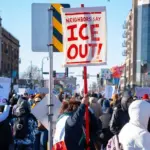 Minneapolis^ Minnesota^ USA 12.12.25 Hundreds of people gather to protest against ICE raids^ Trump and other political views during a cold day in Minnesota