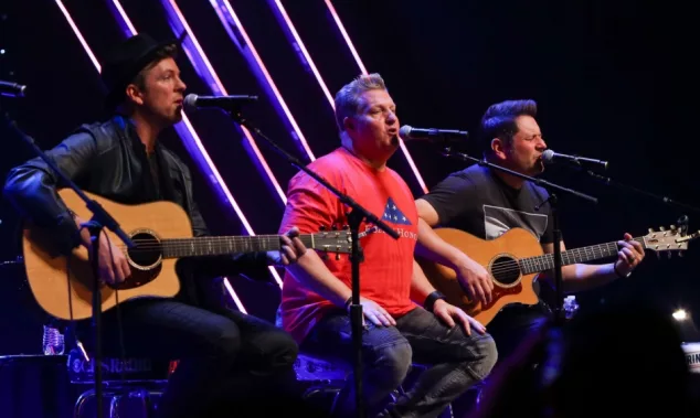 Joe Don Rooney^ Gary LeVox and Jay DeMarcus (L-R) of Rascal Flatts perform at CBS Radio's Stars & Stripes event at the Chicago Theatre on November 9^ 2016 in Chicago^ Illinois.