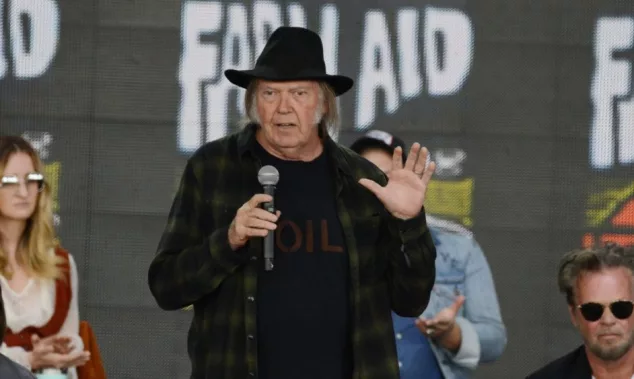 Neil Young talks onstage at the 2018 Farm Aid press conference. Hartford^ CT - September 22^ 2018