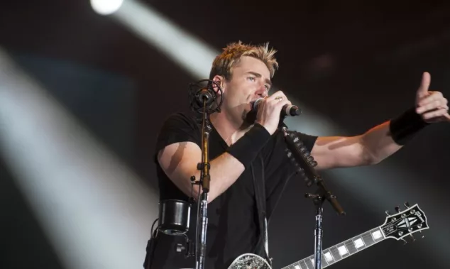 Chad Kroeger^ lead vocalist of the Canadian band Nickelback^ performs during the Rock in Rio 2013 concert^ on September 20^ 2013 in Rio de Janeiro^ Brazil.