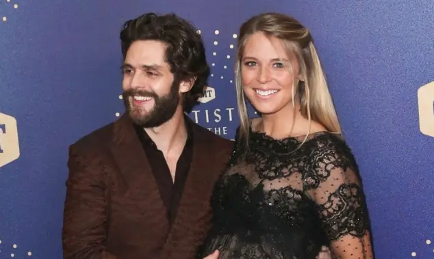Thomas Rhett (L) and wife Lauren Akins attend the 2019 CMT Artists of the Year at Schermerhorn Symphony Center on October 16^ 2019 in Nashville^ Tennessee.