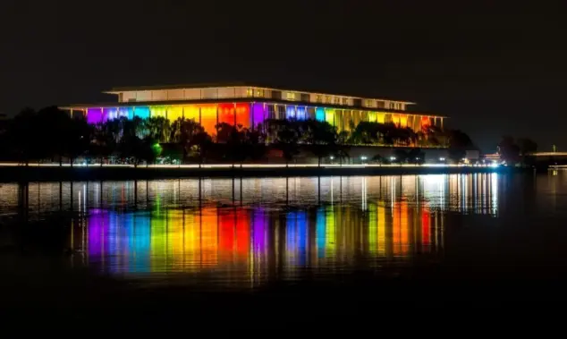 The Kennedy Center illuminated in a rainbow of colors in recognition of the upcoming Kennedy Center Honors. Washington^ DC / USA - November 19^ 2019