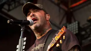Aaron Lewis plays his guitar druing the performance of Staind Rockstar Uproar Festival on September 25^ 2012 in Nampa^ Idaho.