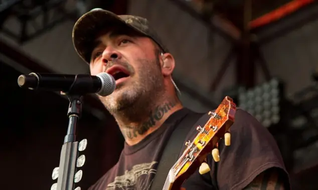 Aaron Lewis plays his guitar druing the performance of Staind Rockstar Uproar Festival on September 25^ 2012 in Nampa^ Idaho.