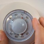 gettyrf_92222_adjustingthermostat-150x150-1-4