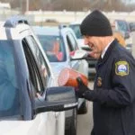 2023-ham-drive-thru-event-jpd-director-elmer-hitt-gives-ham-to-resident-150x150300265-1