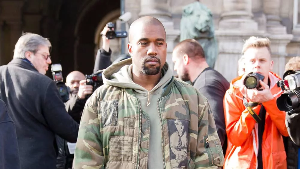 Kanye West iin front of the Dries van noten fashion show. Paris Hotel de ville.