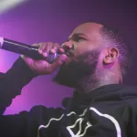 Rapper The Game performs on stage of nightclub.Music hall performing arts event.