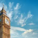 istockphoto-1295031273: Big Ben Clock Tower in London, UK, on a bright day. Panoramic composition withcopy-space, text space on blue sky with feather clouds.