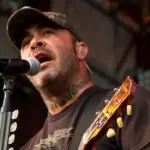 Aaron Lewis plays his guitar druing the performance of Staind Rockstar Uproar Festival on September 25^ 2012 in Nampa^ Idaho.