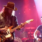 Singers T.J. Osborne (R) and John Osborne of Brothers Osborne perform onstage at the Paramount on May 6^ 2016 in Huntington^ New York.