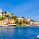 Colored houses village in Symi island^ Dodecanese islands^ Greece.