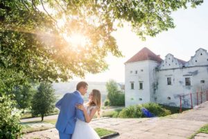 couple in front of mansion