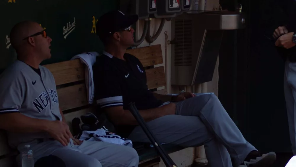 New York Yankees coaches Reggie Willits (left) and Carlos Mendoza (middle) before a game against the Oakland Athletics: Oakland, California - August 28, 2021