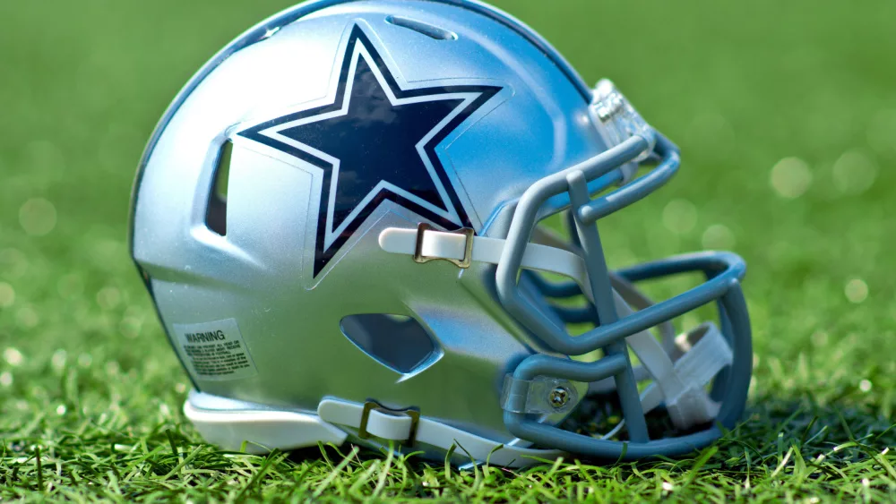 NFL Dallas Cowboys replica helmet on artificial grass