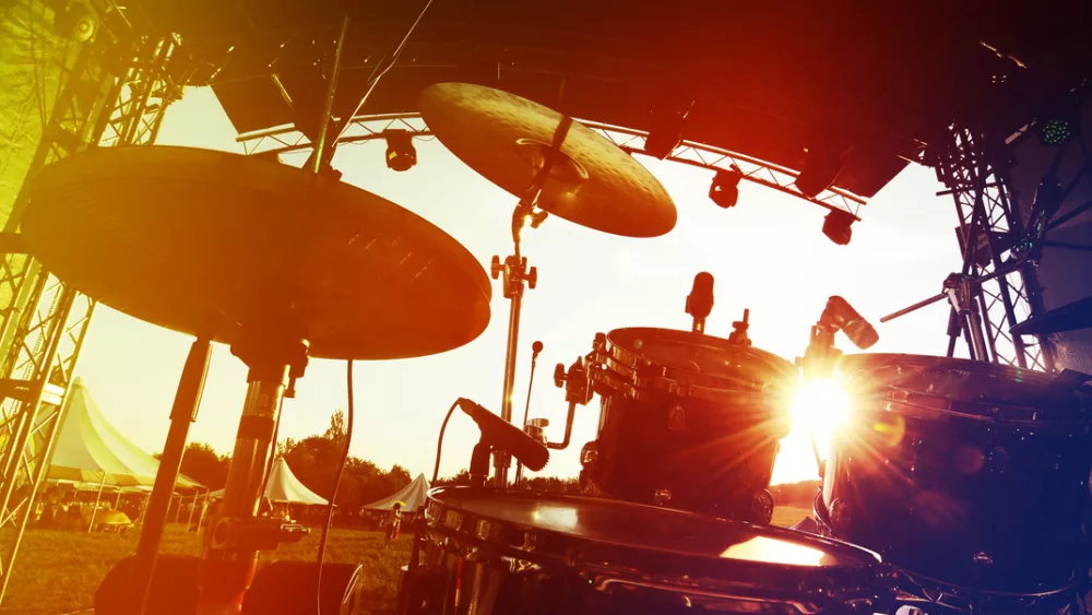 Drum set on stage, silhouette