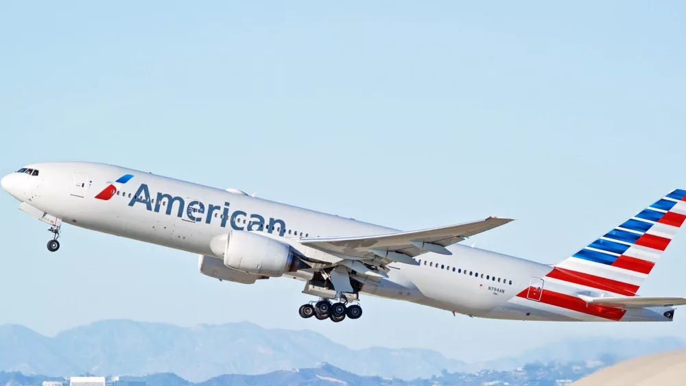 American Airlines Boeing 777-223(ER) aircraft is airborne as it departs Los Angeles International Airport. Los Angeles, California USA