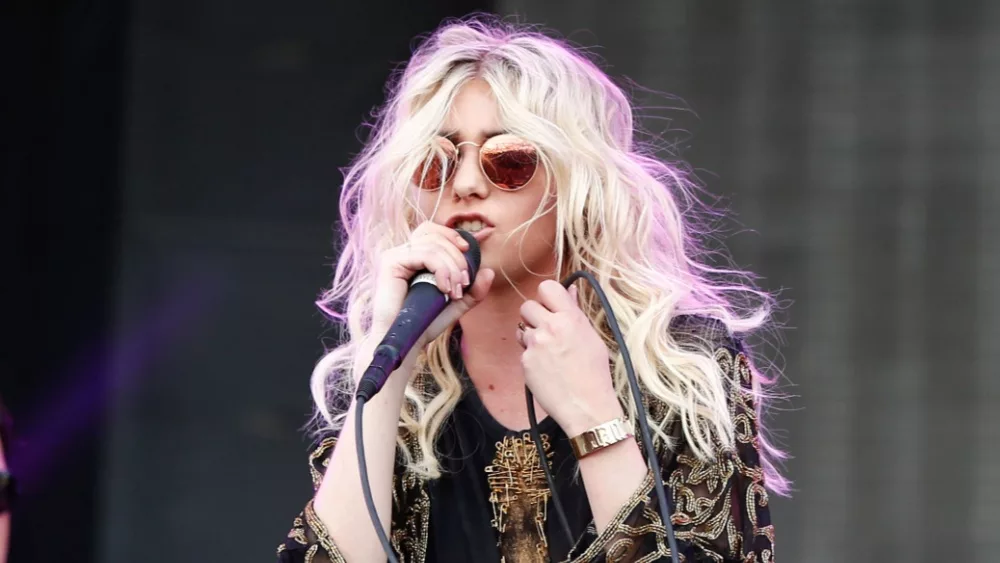 Taylor Momsen (R) and Mark Damon of The Pretty Reckless perform at MGM Resorts Village on September 20, 2014 in Las Vegas, Nevada.